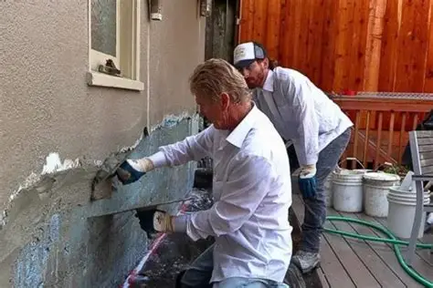 Professional plastering and wall repair services improving exterior property walls.