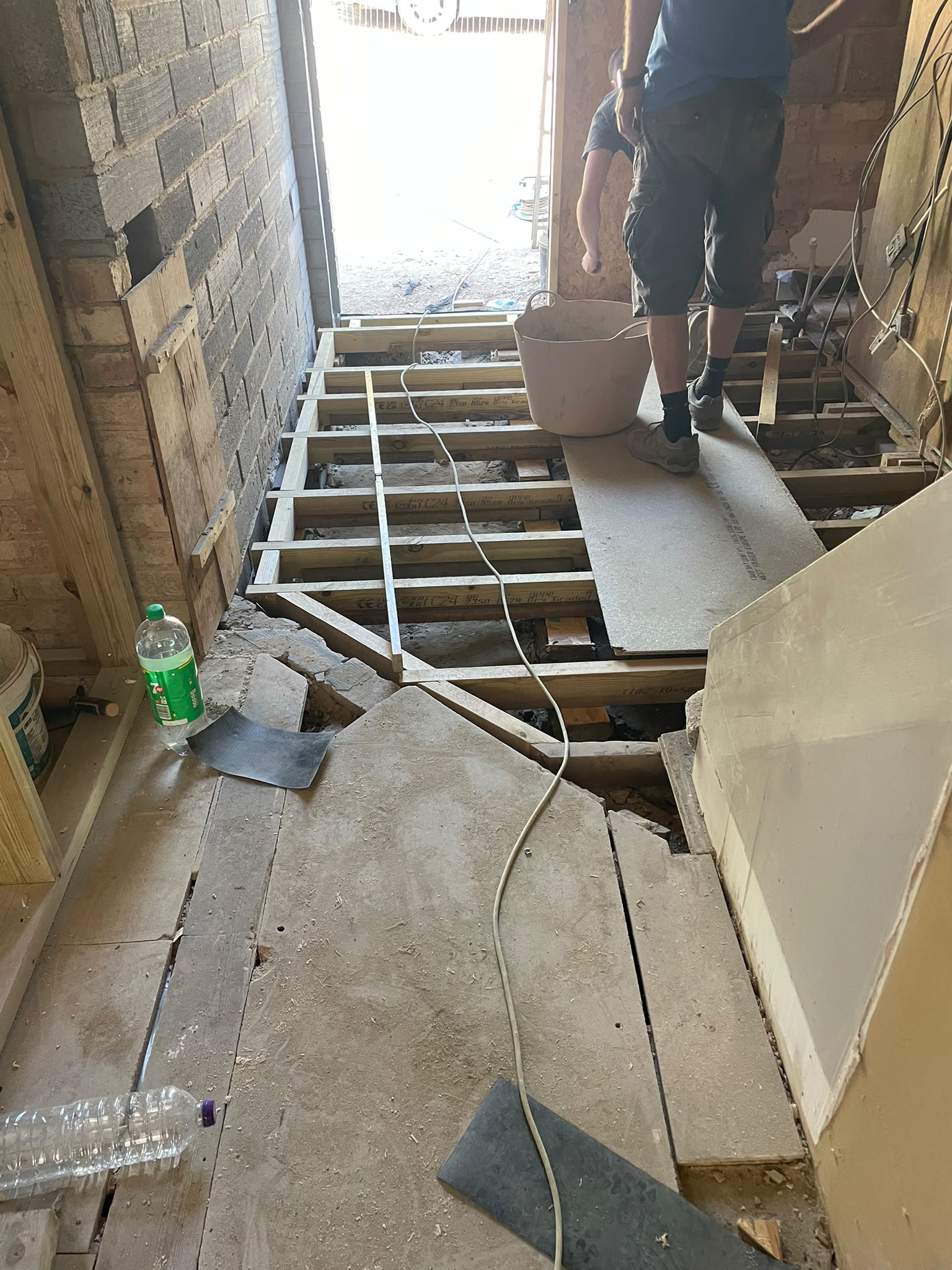 Property refurbishment with floor renovation in progress